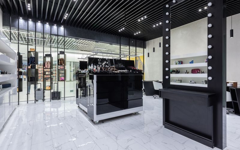 Beauty supply store shelves showing cosmetics and hair care products