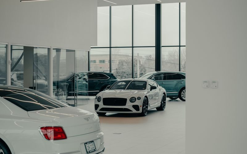 Car dealership showroom interior with vehicles on display