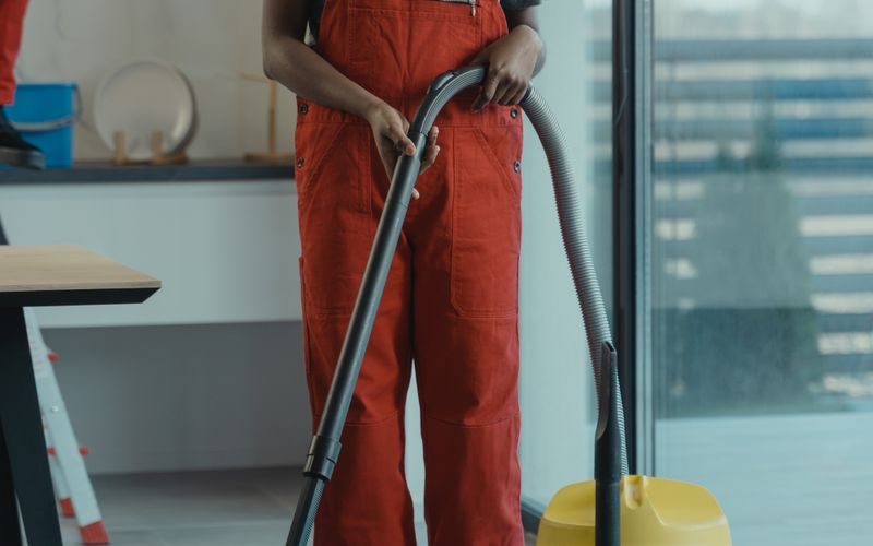 Professional cleaning service worker with equipment