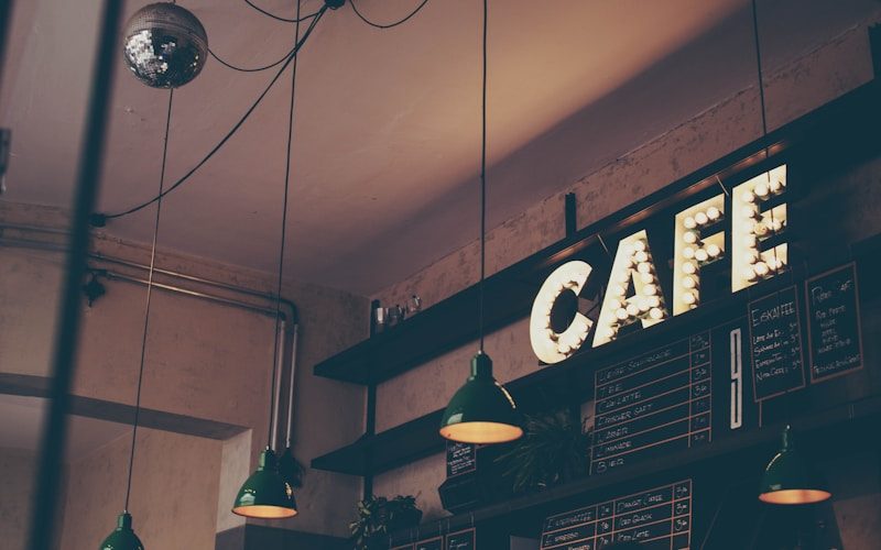 Vendra coffee shop software — barista preparing espresso at café counter