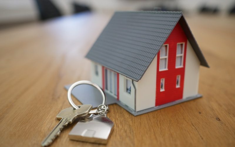 Vendra real estate software — agent showing modern property to clients