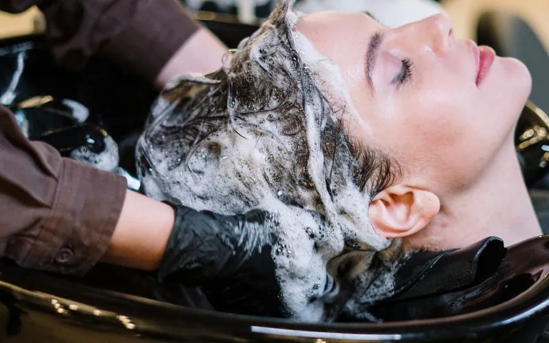 Hair salon interior with service billing and retail product sales via Vendra ERP