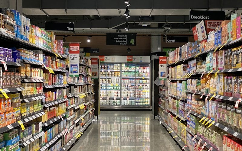 Vendra ERP supermarket POS — cashier scanning items at checkout