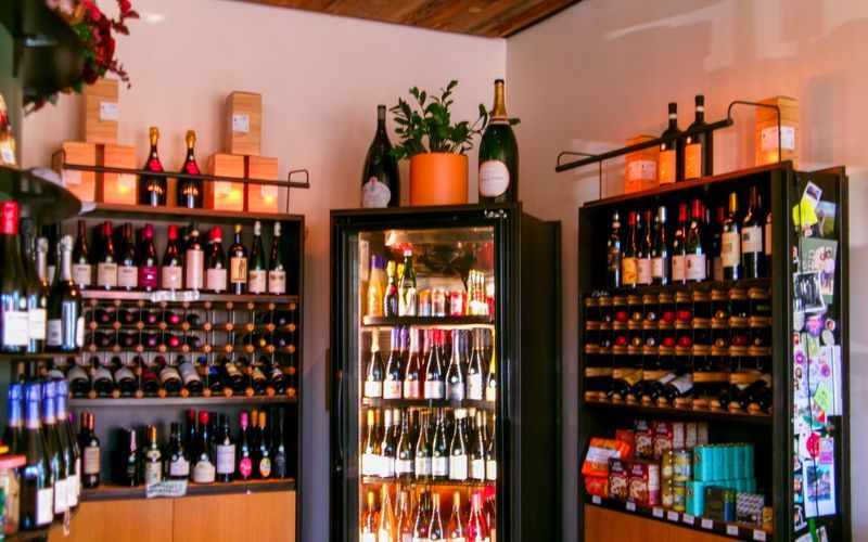Vendra wine and liquor store software — bottles on wooden shelves