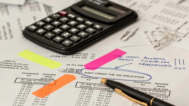 Cloud accounting software for small businesses — financial documents and calculator on desk