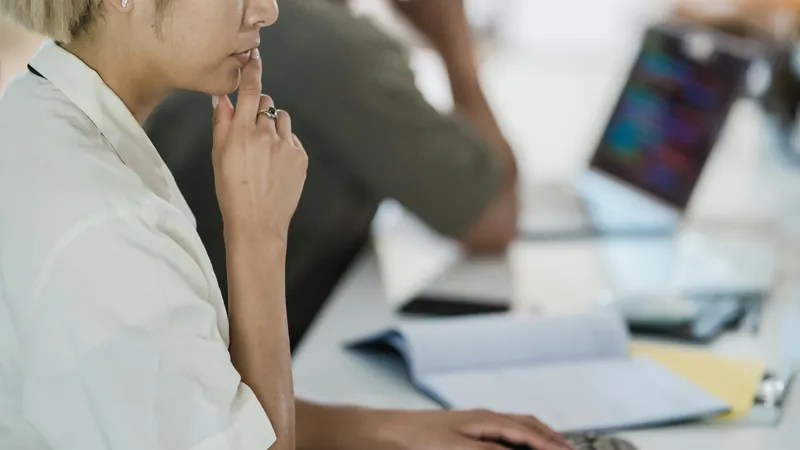Payroll software — HR manager processing employee payroll at office desk